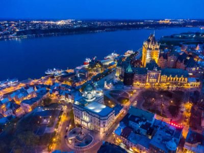Aerial view of Aerial view of Old Quebec at night with Louis St-Laurent Building, Chateau Frontenac and St. Lawrence river in background during springtime